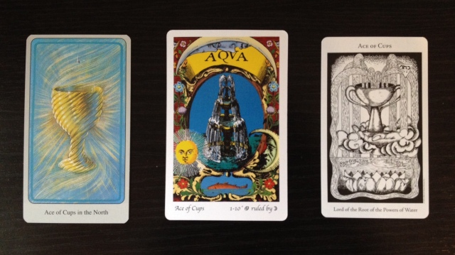 Ace of Cups from the Haindl, Tarot of the Holy Light, and Hermetic Tarot